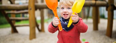 toddler-boy-playing-in-the-playground-summer-day-PB8C7FR.jpg